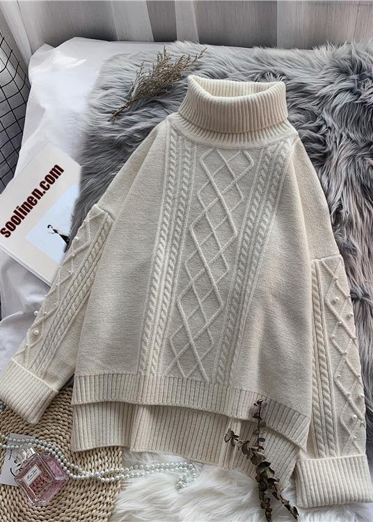 Cozy high neck beige knitwear  spring fashion low high design knit tops